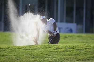 Graeme Storm chips in from a bunker